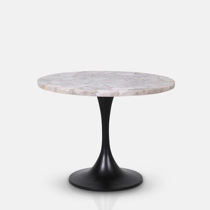A cutout of the Stamford Side Table, a simple modern table with a round luxe monochrome marble top