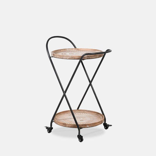 Round drinks trolley on wheels, with two engraved brown wooden shelves and black metal frame.