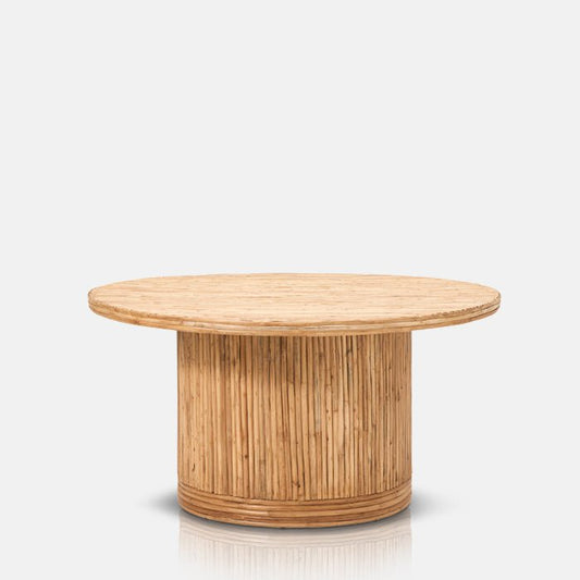 Round wood and rattan coffee table in warm natural finish.
