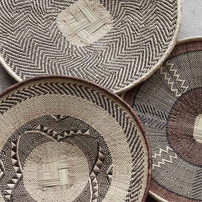 The Toledo Basket, a circular wide shallow woven basket with a geometric tribal pattern.