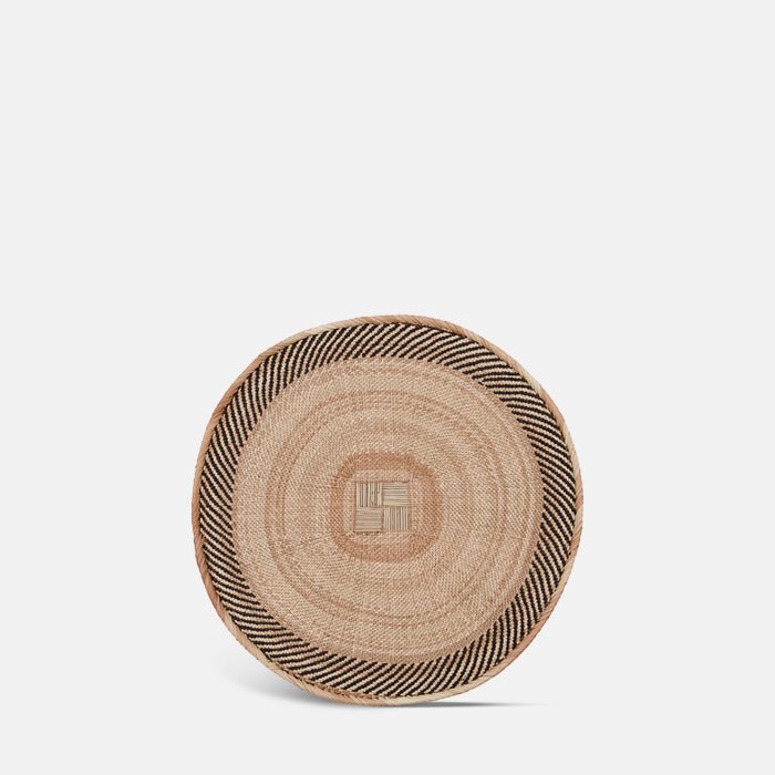 The Toledo Basket, a circular wide shallow woven basket with a geometric tribal pattern.