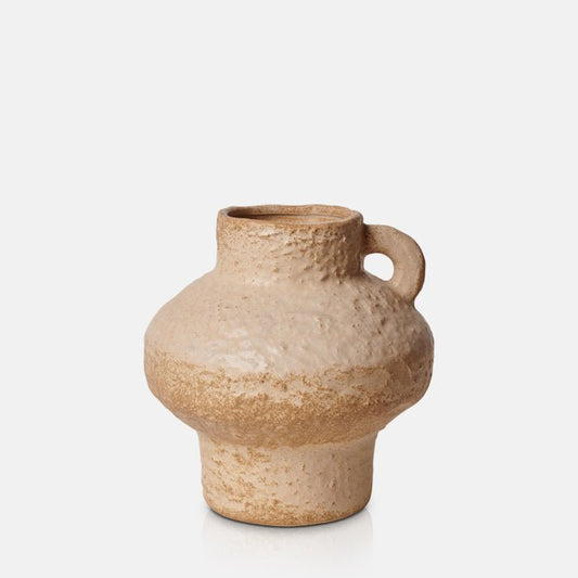 Textural light brown vase with a single handle and a curvy shape. Sign up for exclusive discounts and interior styling tips and tricks.