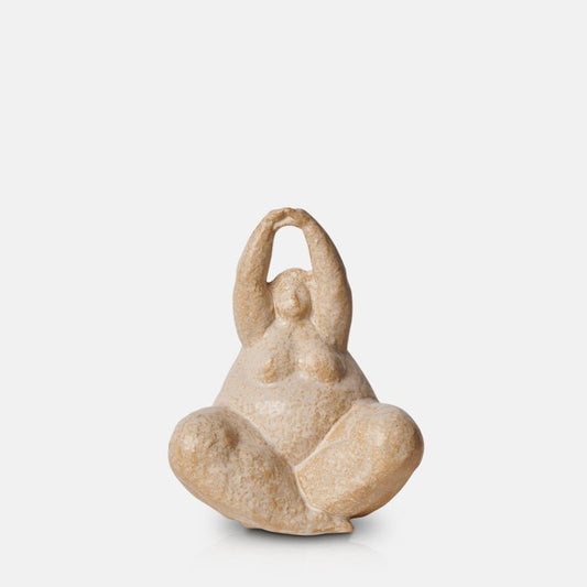 Creamy brown ceramic female cross legged sculpture with arms raised
