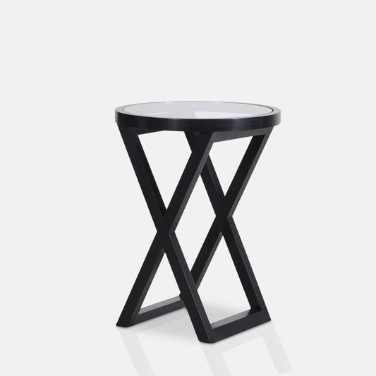 Round black side table with a cross frame and a clear glass top