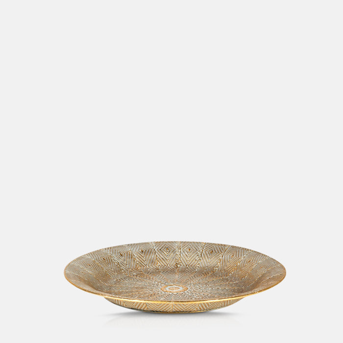 Large round golden tray with a slight raised edge and a decorative pattern