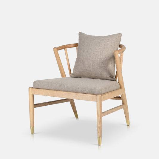 Modern, curved wooden armchair with a grey cushioned base and matching grey cushion on its back
