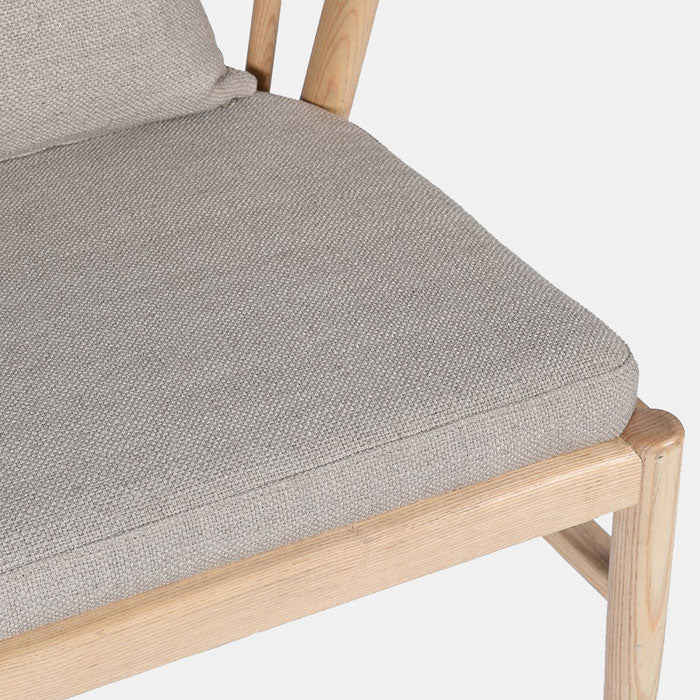 Soft grey cushioning enclosed by a light wooden frame
