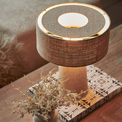 A soft fabric table lamp made from linen. Abigail Ahern recommends adding lots of table lamps to create extra ambience and a welcome home.