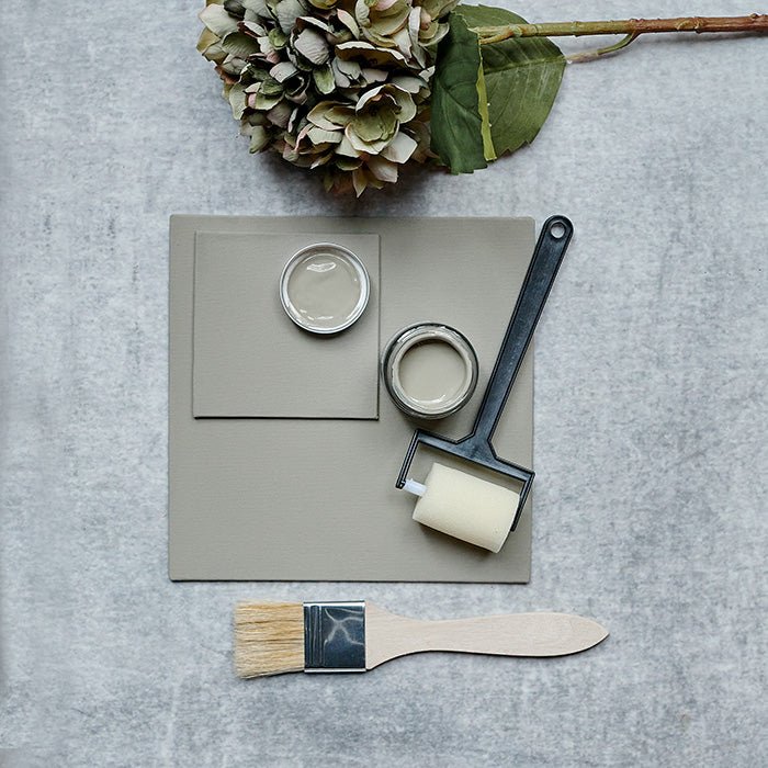 A large painted swatch demonstrating a soft light green luxury paint for walls, ceilings and interior woodwork. Woodstock paint is a soft green wall colour perfect for creating an accent wall. 