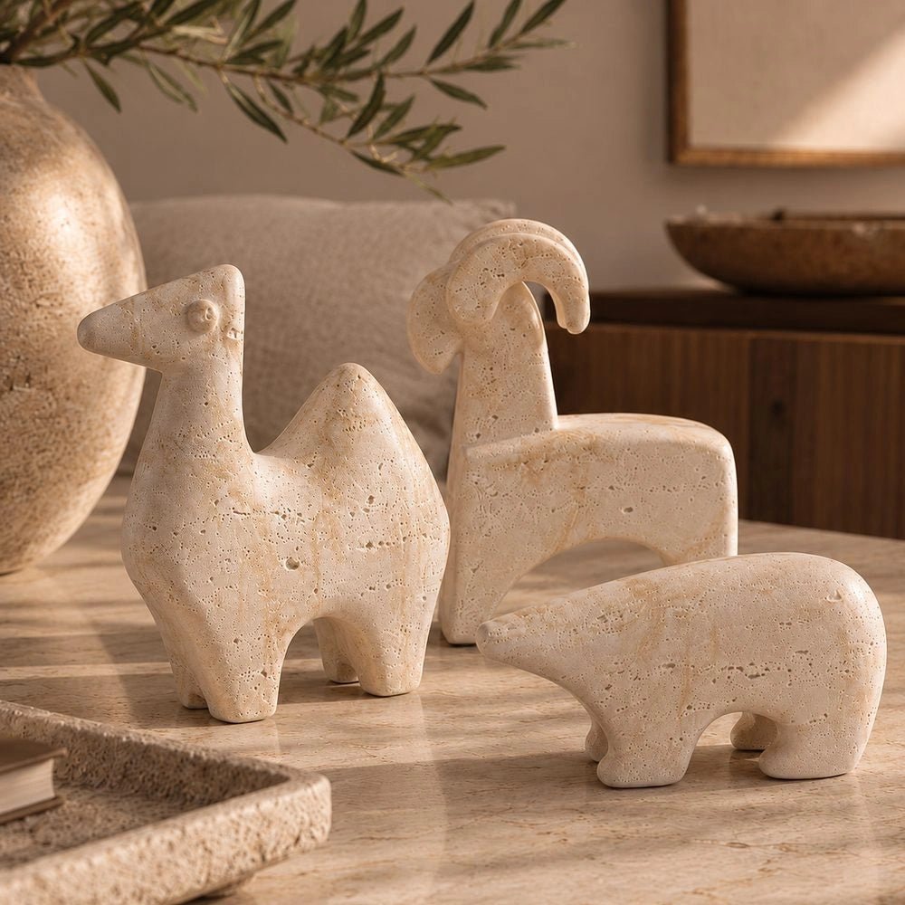 Close-up of the Animal Sculptures set showing three pale abstract animal figures, highlighting their textured surfaces, rounded forms and contrasting sculptural profiles.