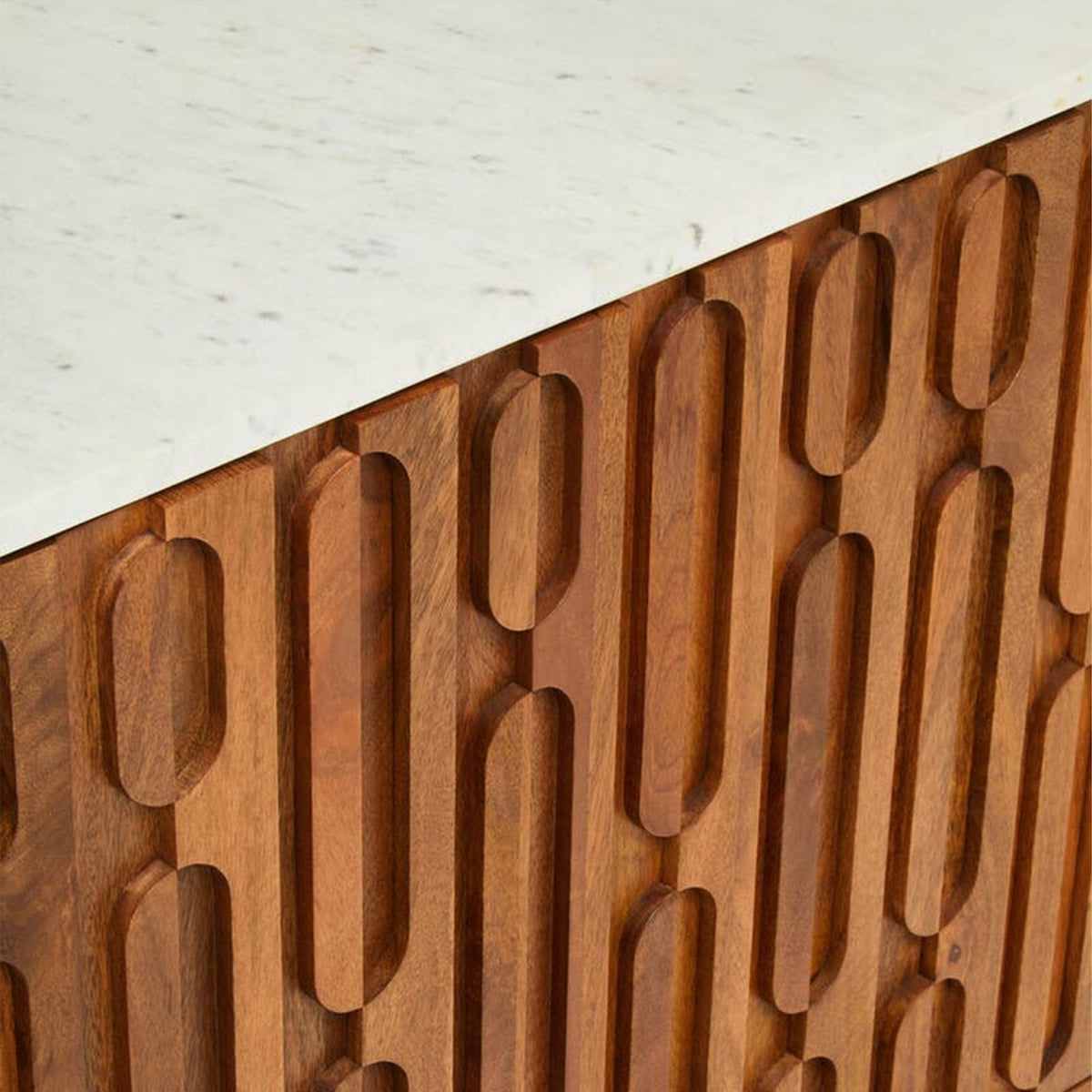 Close-up of the Abigail Ahern Attingham Sideboard showcasing the natural variation and characterful grain of mango wood alongside its distinctive and contrasting real marble surface.