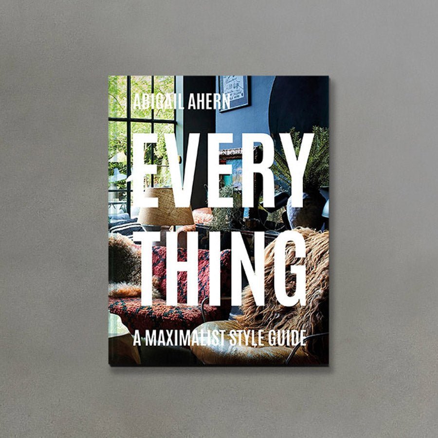 Everything: A Maximalist Style Guide, an A4 sized hardcover book on interior design, with the title in bold white font. 