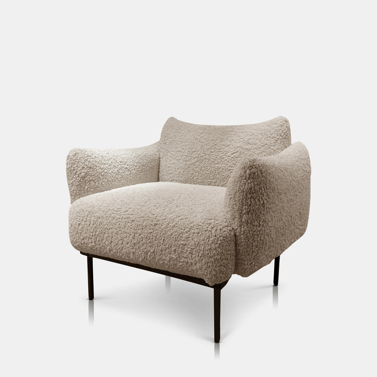 Cream boucle armchair with a soft textured fabric finish, comfortable cushioned seat and contemporary structured silhouette. Belville Armchair by Abigail Ahern, crafted in a luxurious boucle upholstery designed to create a cosy and stylish focal point in modern interiors. A statement accent chair perfect for living rooms, bedrooms and dining spaces, adding warmth, texture and timeless elegance to luxury home decor.