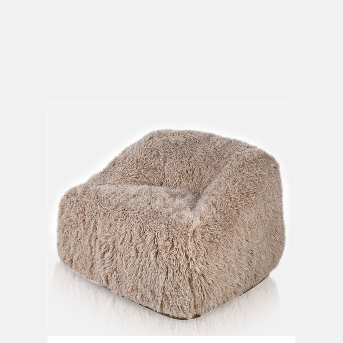 Abigail Ahern Bertha Faux Fur Armchair shown from the side, showcasing its oversized rounded silhouette, deep cocooning seat and thick textured faux fur upholstery.