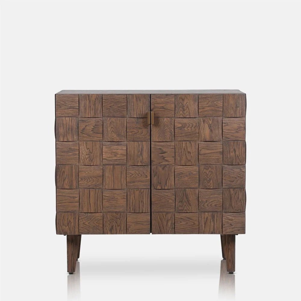 Bradley Wooden Cabinet with two square patterned doors, a warm brown wooden finish and slim tapered legs, shown straight on with both doors closed.