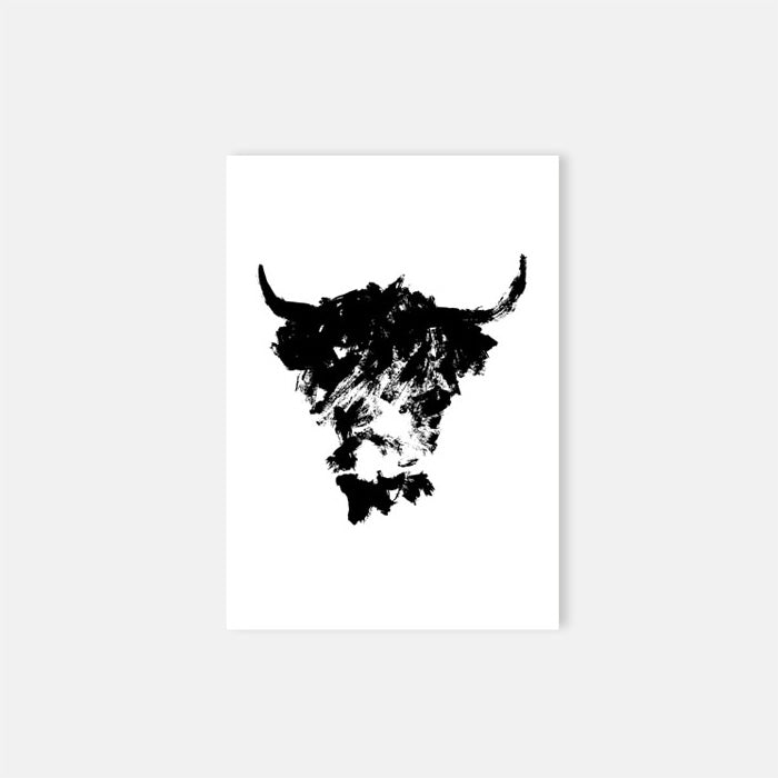 Abstract black brushstroke drawing of a shaggy cow on white paper