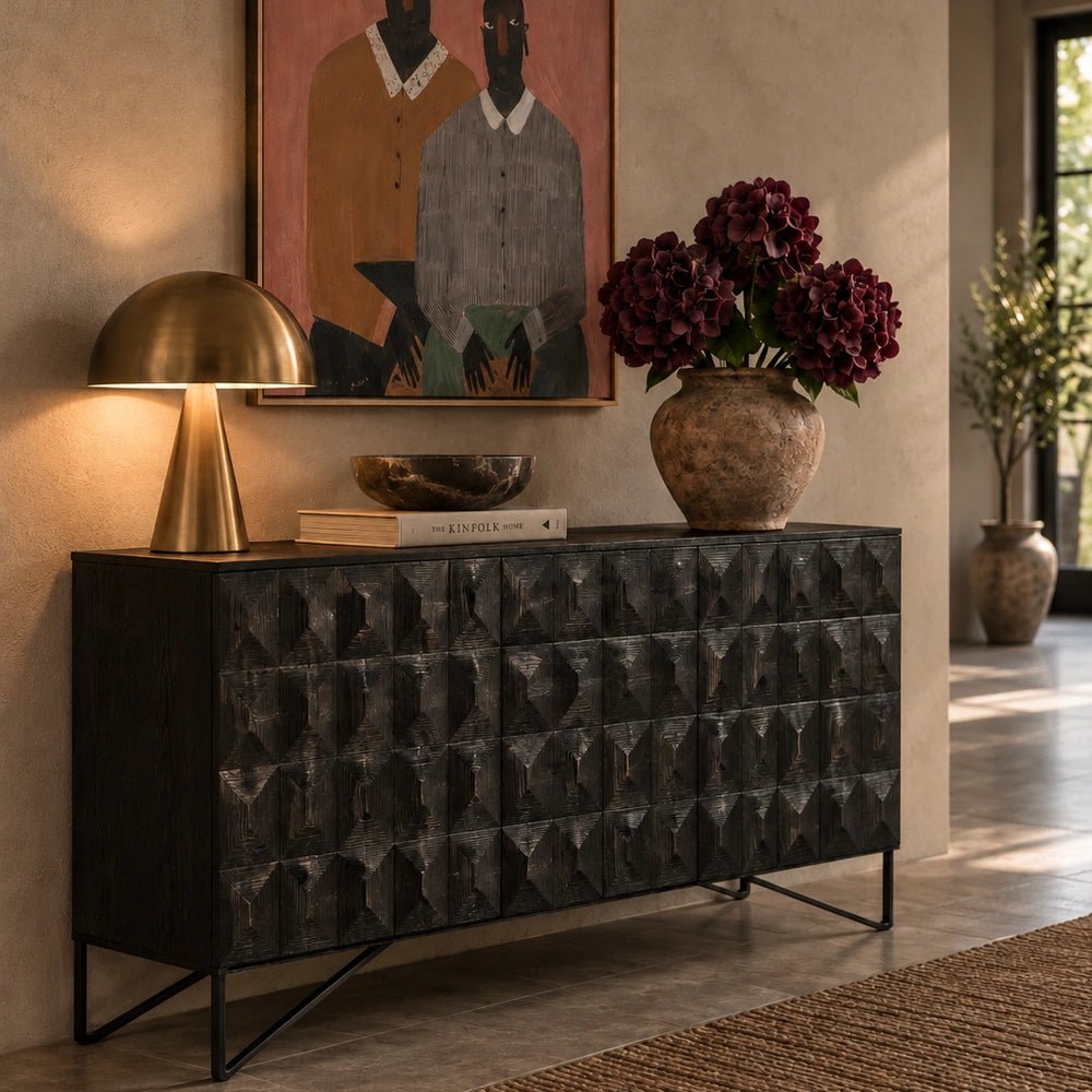 Bronte Wooden Console Table styled beneath framed artwork with sculptural vessels and decorative objects in a warm, layered contemporary interior.