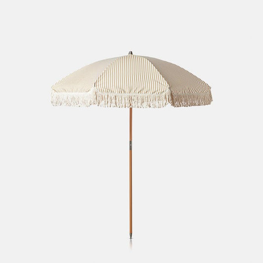 Cutout image of our white and sand striped garden umbrella opened. This timeless umbrella has a wooden pole and is capped on both ends with metal.
