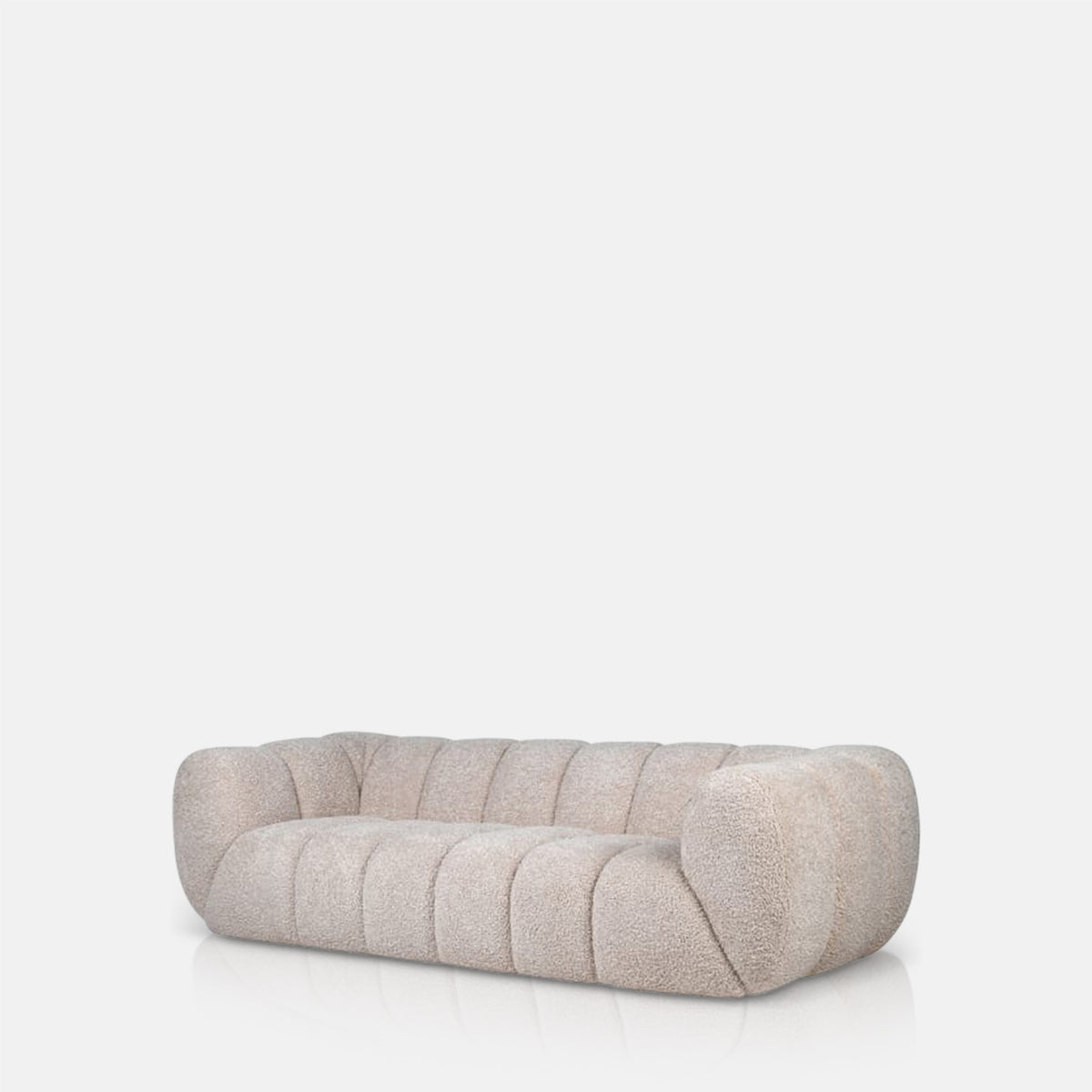 Luxury beige 3 seater sofa with a plush upholstered finish and sculptural modern silhouette. Cheverell 3-Seater Sofa by Abigail Ahern, designed with a soft neutral fabric and generous proportions for ultimate comfort and relaxed living. A statement contemporary sofa perfect for modern living rooms, luxury interiors and cosy lounge spaces, adding timeless elegance, texture and sophisticated style to your home decor.