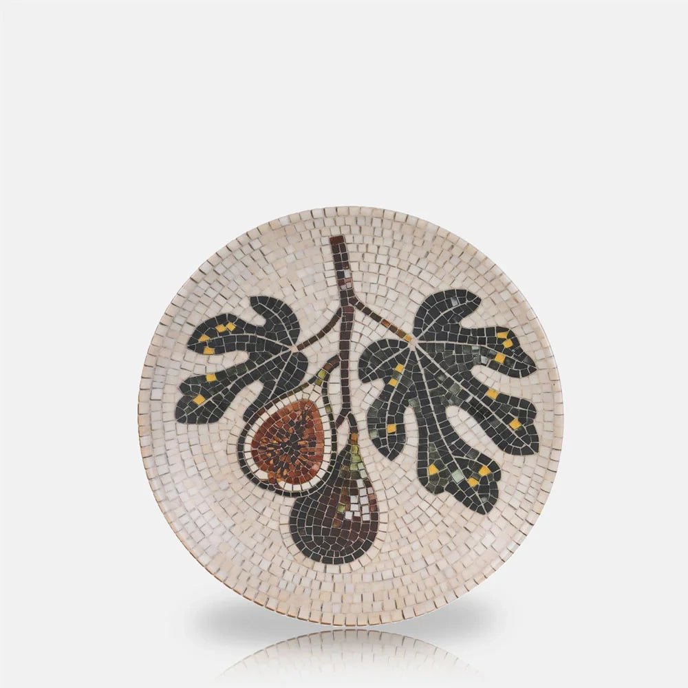 Corbett Mosaic Dinner Plate features a fig and leaf motif in muted green and earthy tones, set against a cream mosaic patterned surface.