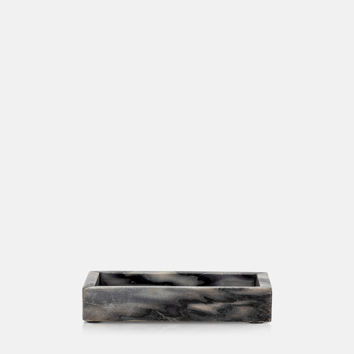 A cutout of the Creston Marble Tray, a small slim rectangular tray in inky dark hues with contrasting lighter tones.