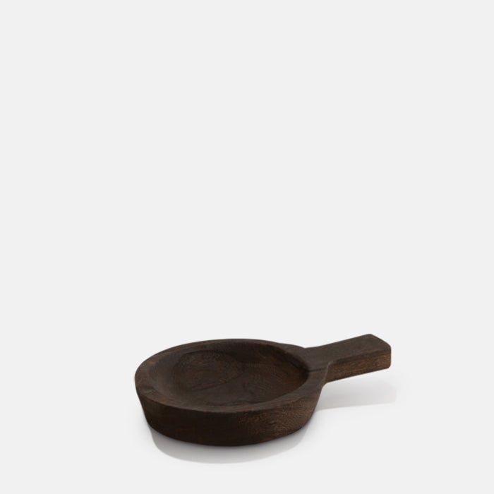 A cutout of the Dagora Wooden Dish, a small round dish with a handle in a dark wood stain finish.