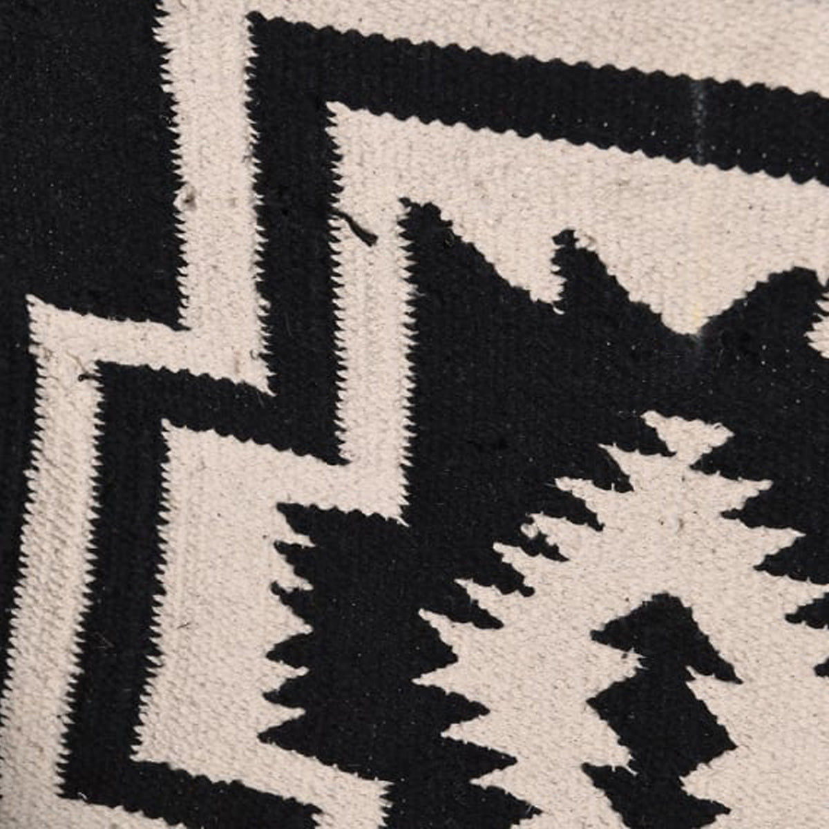 Close-up of the woven Kilim fabric pattern on the Dallas sling chair by Abigail Ahern.
