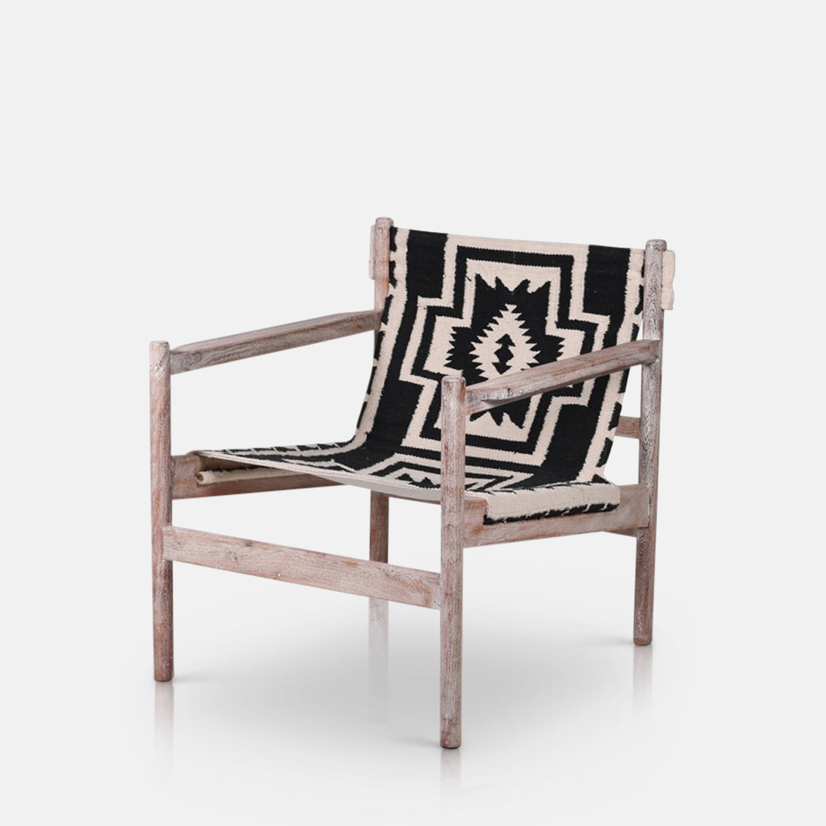 Abigail Ahern Dallas patterned sling chair with Kilim fabric seat and solid acacia wood frame.