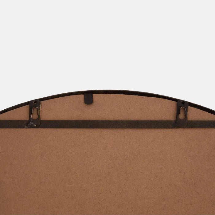 A closeup of the back of the Dilman Mirror.