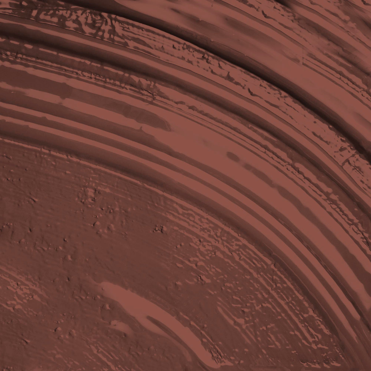 A paint stroke of a rich terracotta paint colour with red undertones.