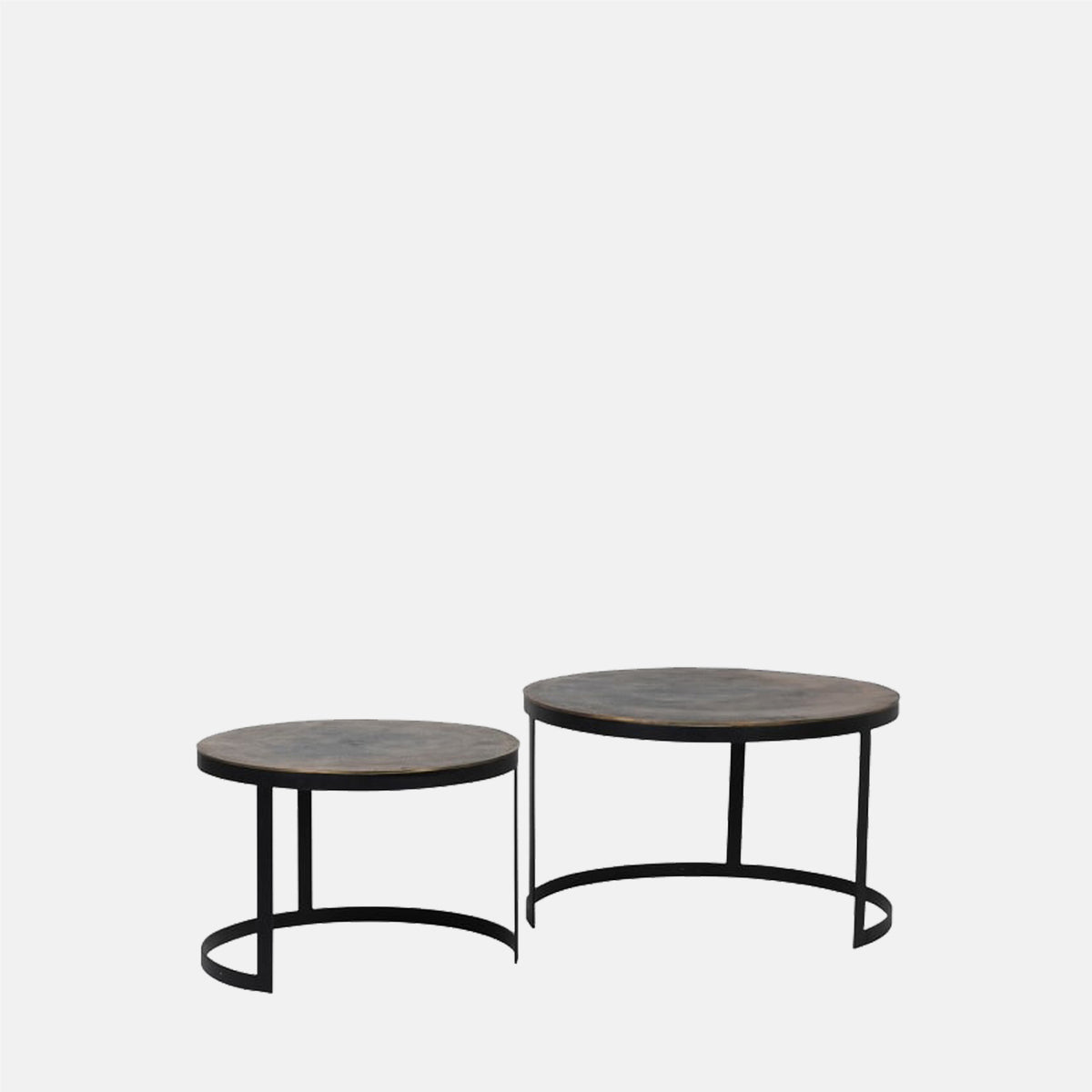 Easton Brass Nesting Tables, a pair of round tables in an antique style brass finish with a curved black industrial look base.
