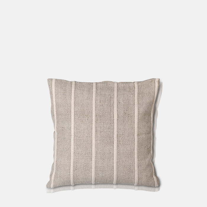 A cutout of the Edwina Striped Cushion, an elegant sandy beige cushion with ridged piping detail.