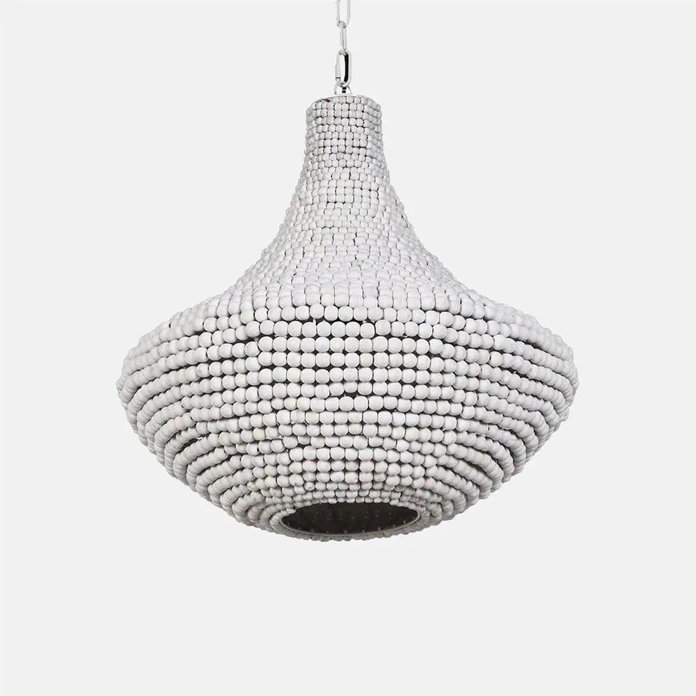 Eloise Beaded Chandelier features a rounded teardrop silhouette formed from rows of pale beads, with a dark circular opening beneath and chain suspension above.