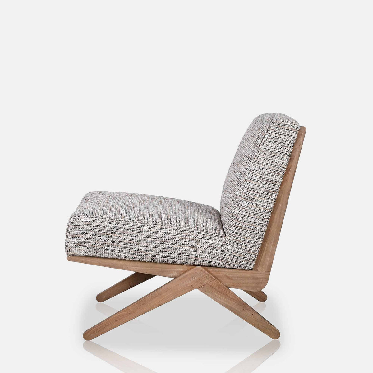 Abigail Ahern Exbury Modern Armchairs in soft grey patterned upholstery, featuring low angled silhouettes, wide cushioned seats and wooden legs
