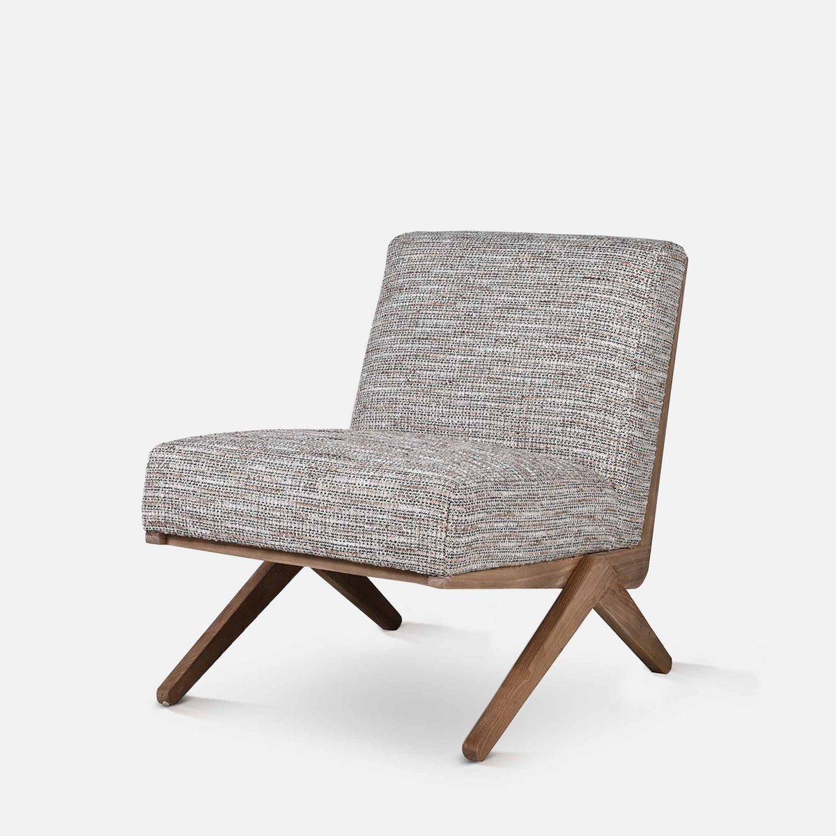 Abigail Ahern Exbury Modern Armchairs in soft grey patterned upholstery, featuring low angled silhouettes, wide cushioned seats and wooden legs