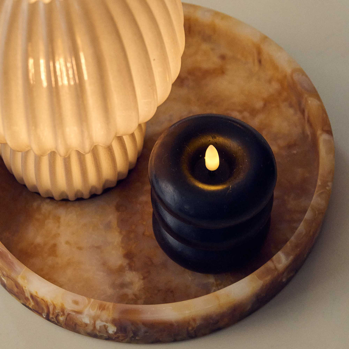 Foley LED Candle - Medium, a top view of a black battery operated lamp.