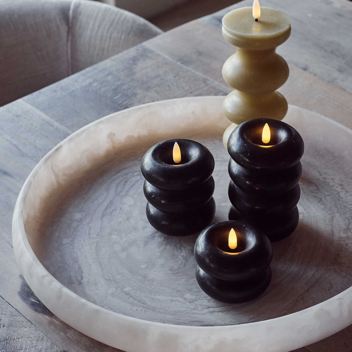 Foley LED Candle - Medium, shown next to 3 other battery candles on a tray.