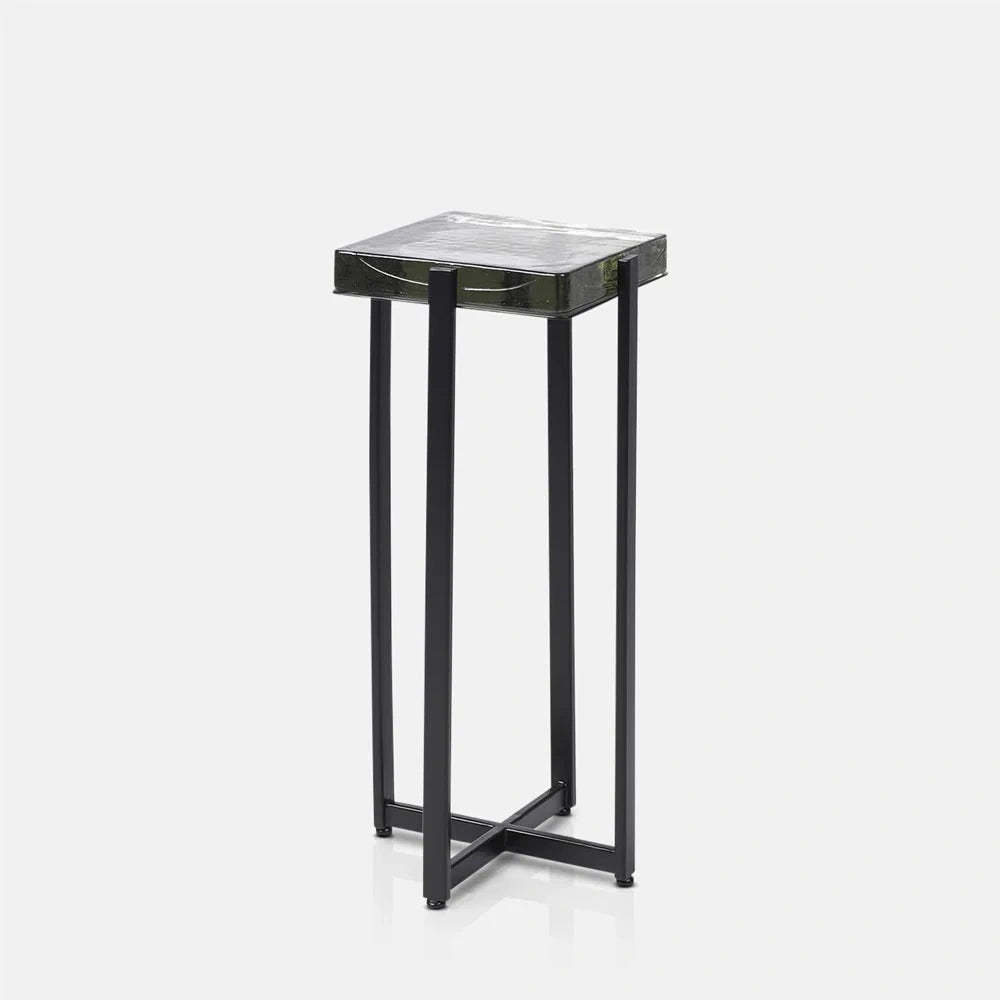 Fordham Glass Side Table features a square textured glass surface above narrow dark legs and crossing base supports, viewed from a slight angle.