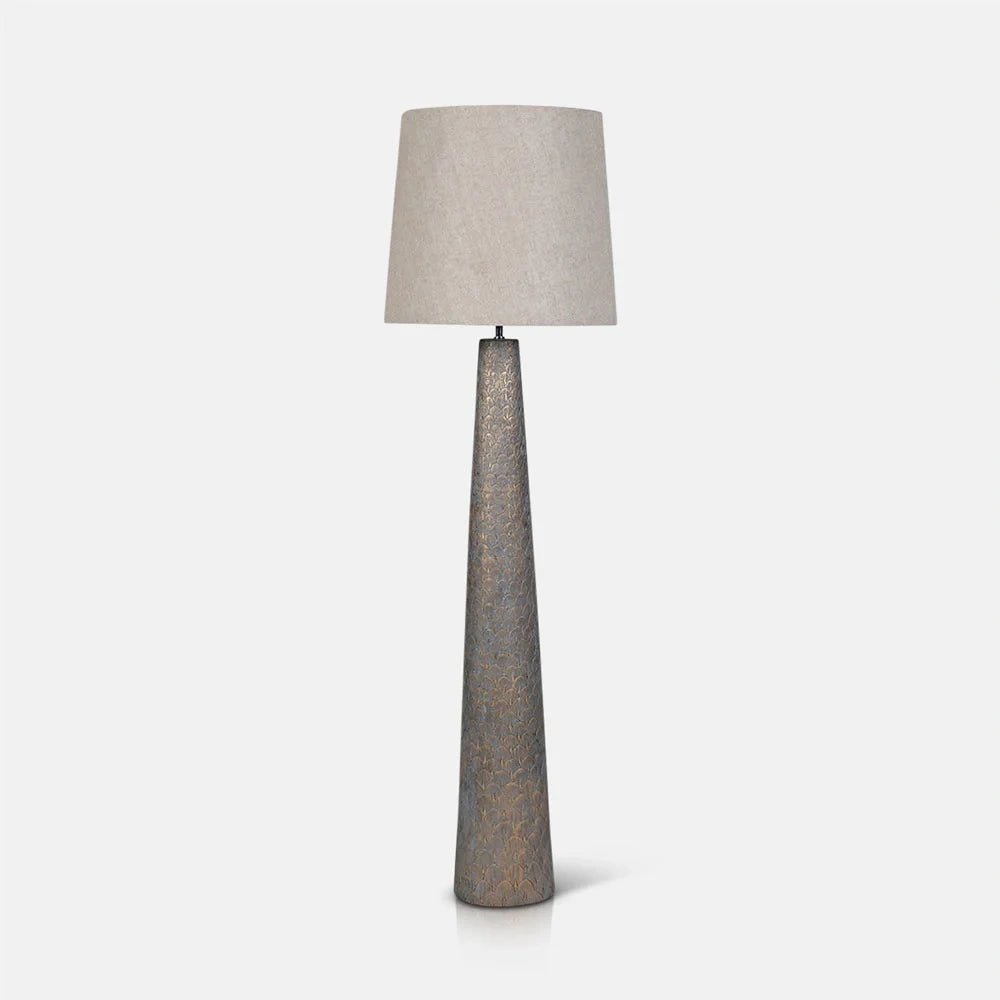 Haverford Polyresin Floor Lamp features a tall tapered patterned base in a muted neutral finish, topped by a simple pale fabric shade.