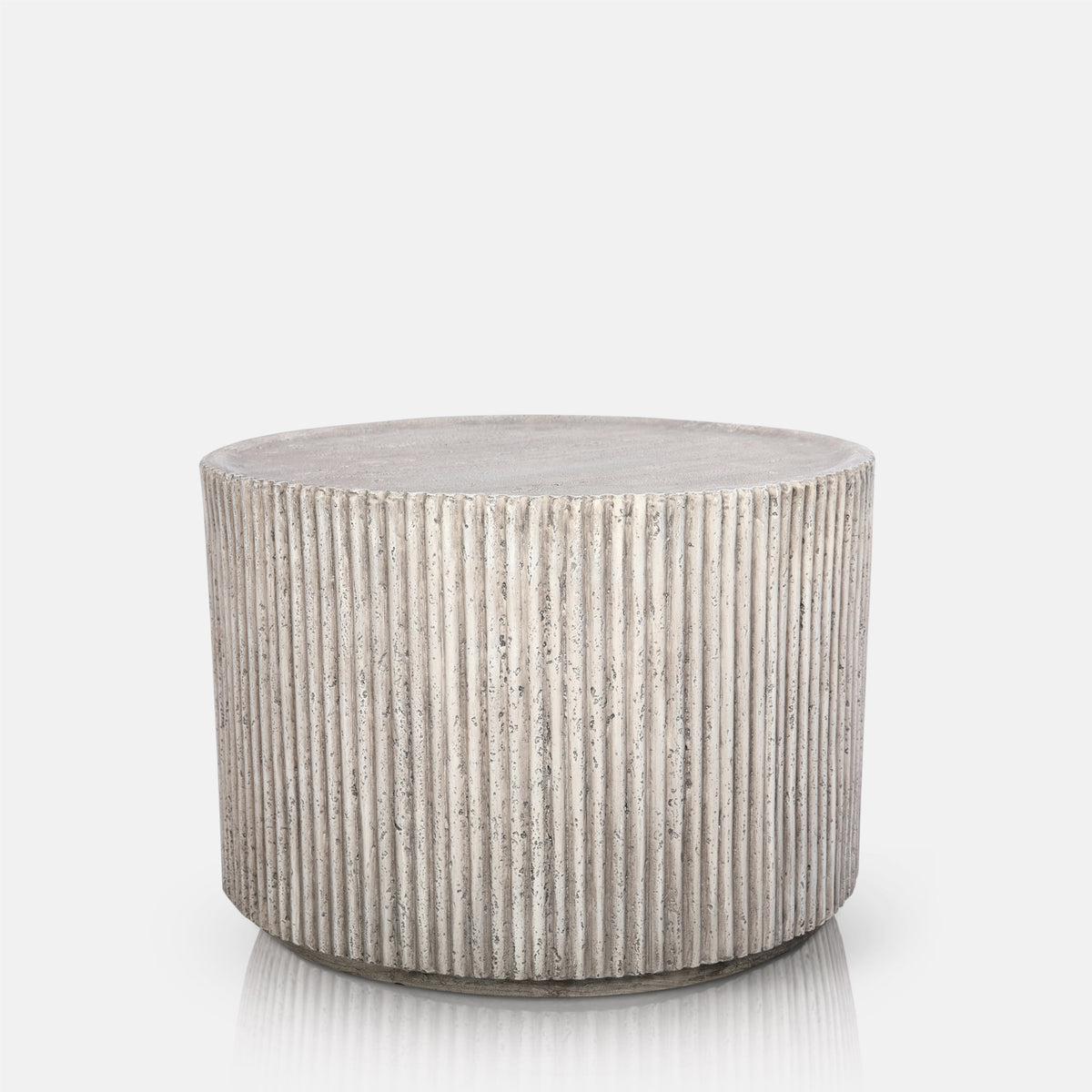 Abigail Ahern Hereford Stone Coffee Table in grey stone-effect finish with a simple round silhouette and textured ribbed pedestal base.