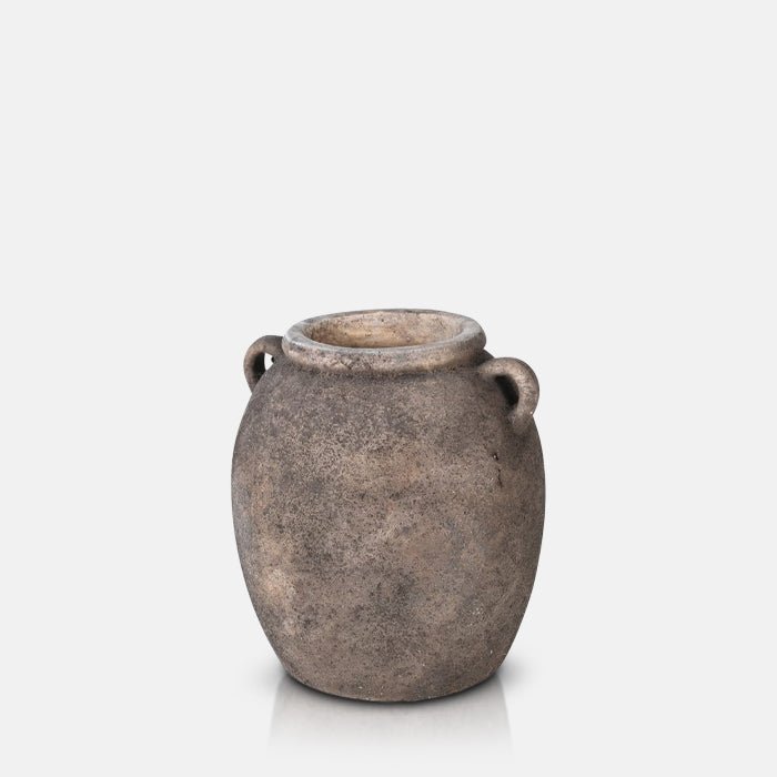 A cutout of the Isador Vase, a rounded ceramic vase in a rustic brown finish with two handles.