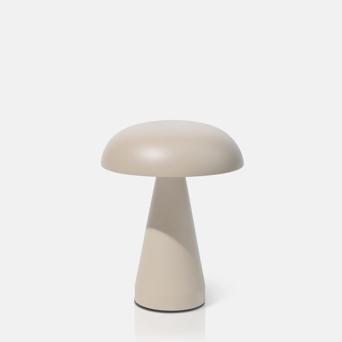 Mushroom-shaped portable table lamp on a white background