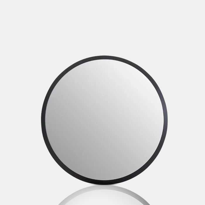 The Large Della Mirror, a round modern contemporary mirror with a smooth black MDF frame.