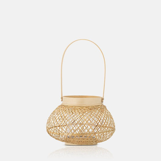 Cutout image on a white background  of a pale bamboo woven lantern that could hold a candle.