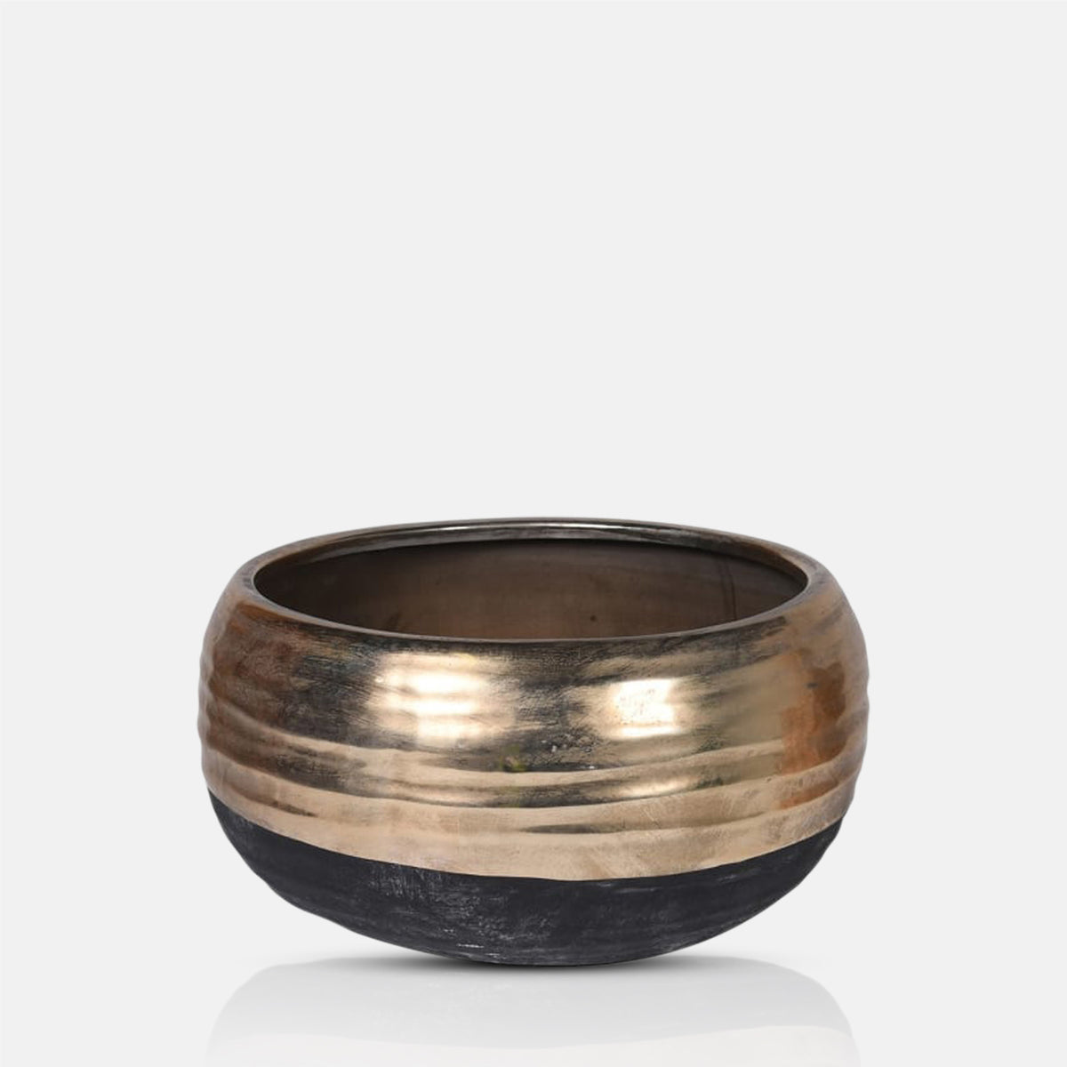 A cutout of the Merritt Stone Decorative Bowl, a sleek wide low black bowl with a wide gold band around the top.