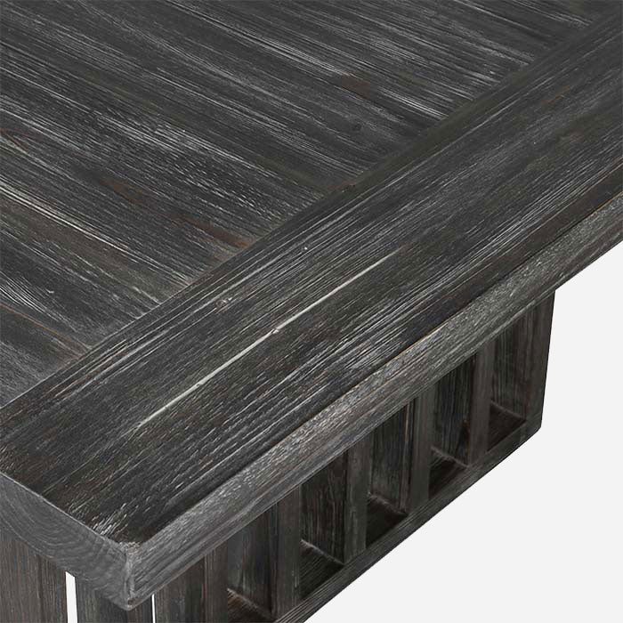 A closeup showing the limewashed effect on the dark fir wood surface of the Newton Grey Wood Coffee Table.