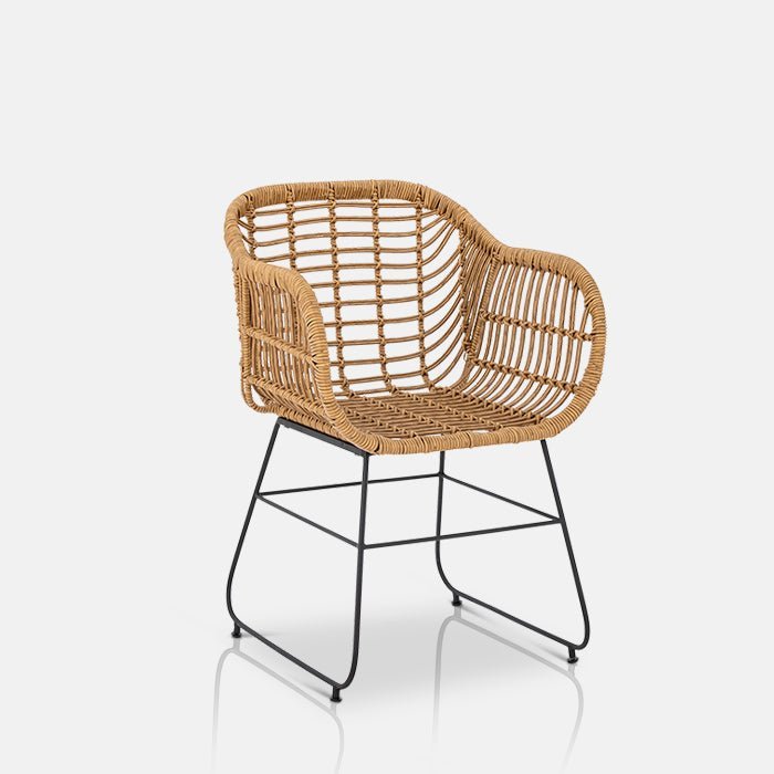 A cutout of the Ormelle Lounge Chair. A polyrattan lounge chair with wide legs for stability in a black metal finish.