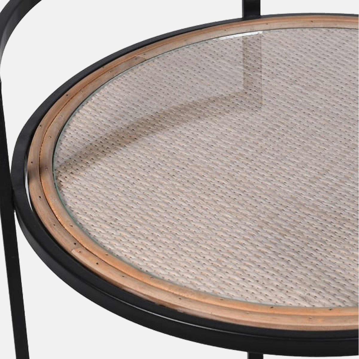 A closeup of the detail of the rattan shelf on the Orwood Round Drinks Trolley.