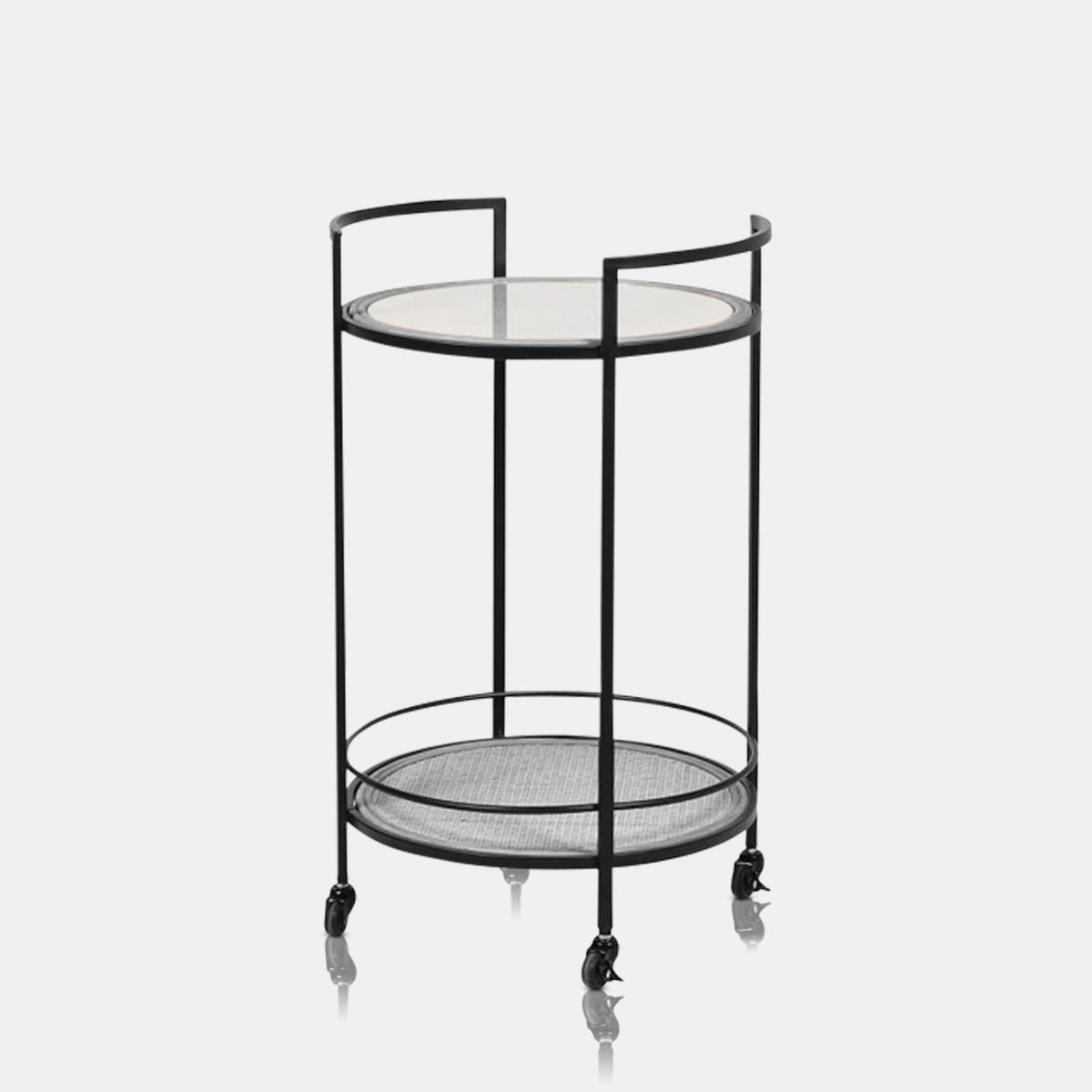 Orwood Round Drinks Trolley, with one rattan and one clear glass shelf in circular design with slim black legs and handles.