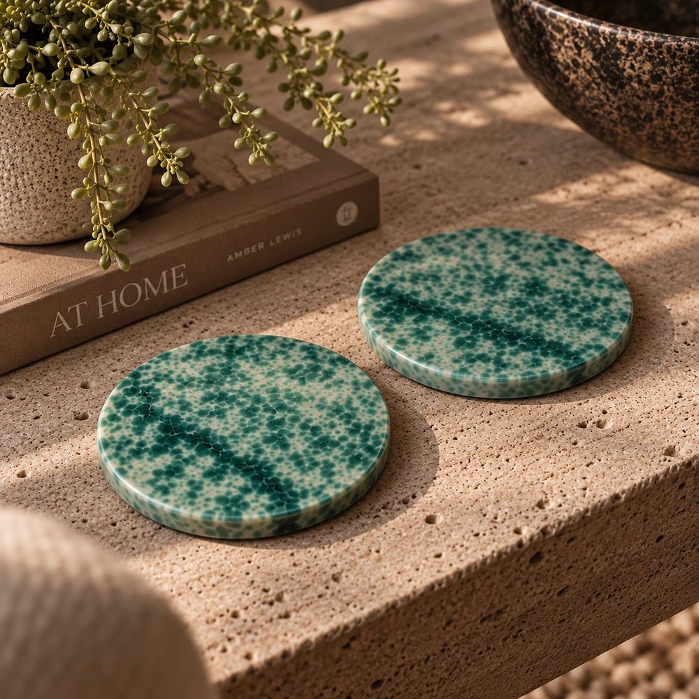 Pendry Ceramic Serving Board - Set of 2 with softly speckled neutral ceramic surfaces, styled on a dining table with glassware, bowls and warm decorative accessories.